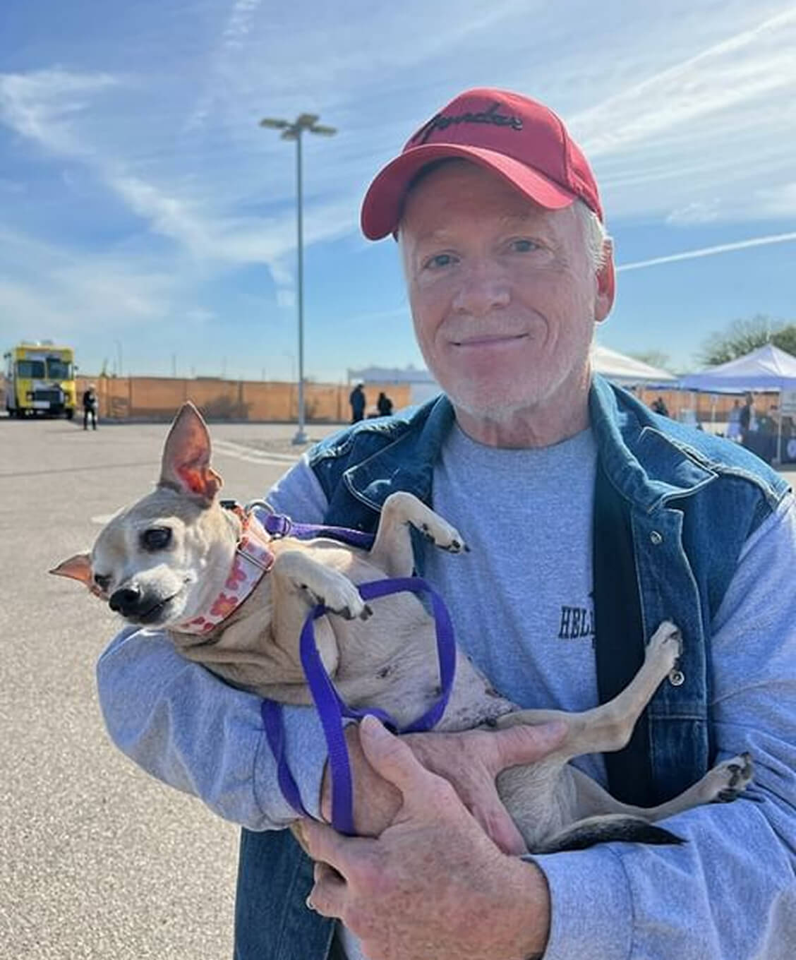 Person Carrying a Dog