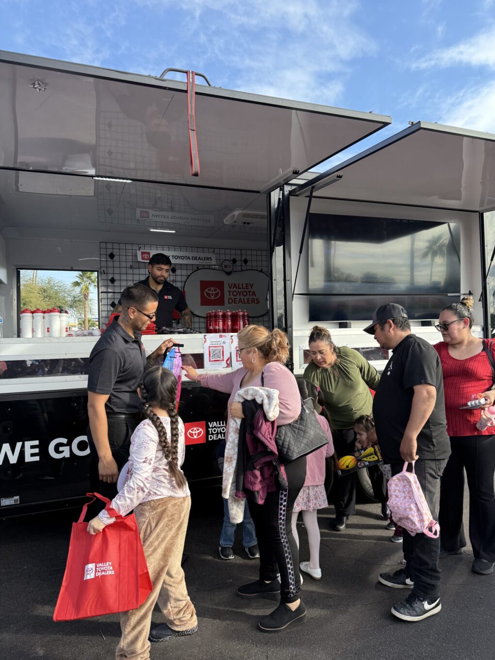 People interacting with the wheel of fortune.