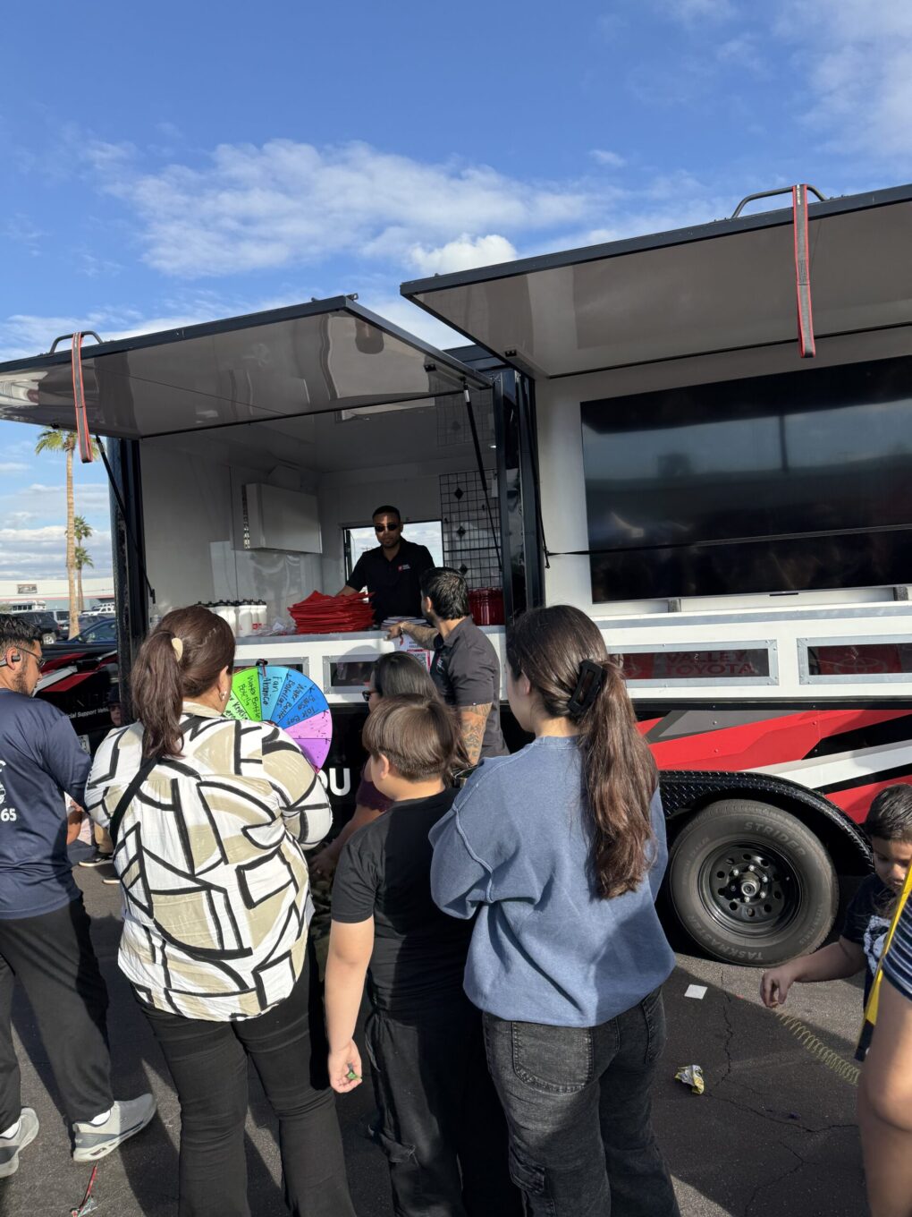 People in line to spin the wheel of fortune.